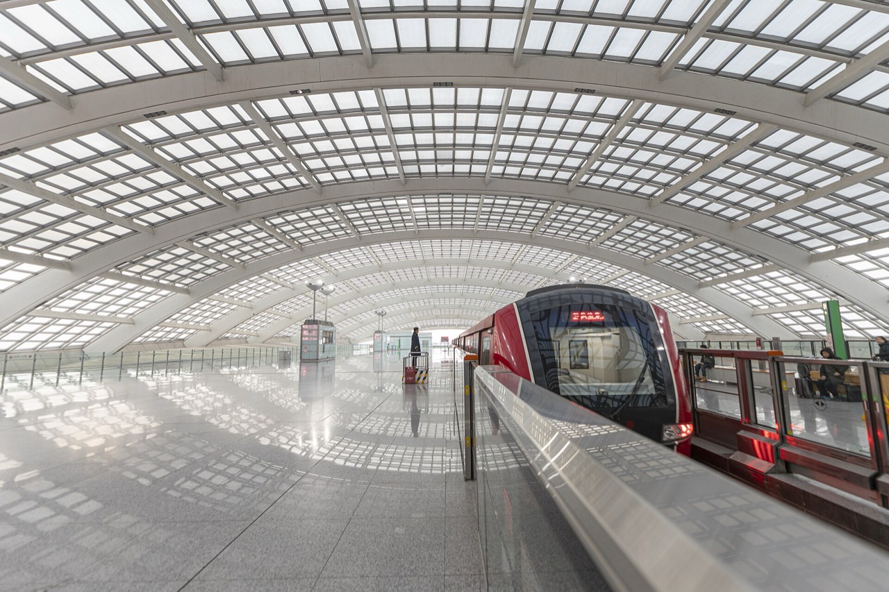 Airport Express train under the glass roof at Beijing Capital Terminal 3