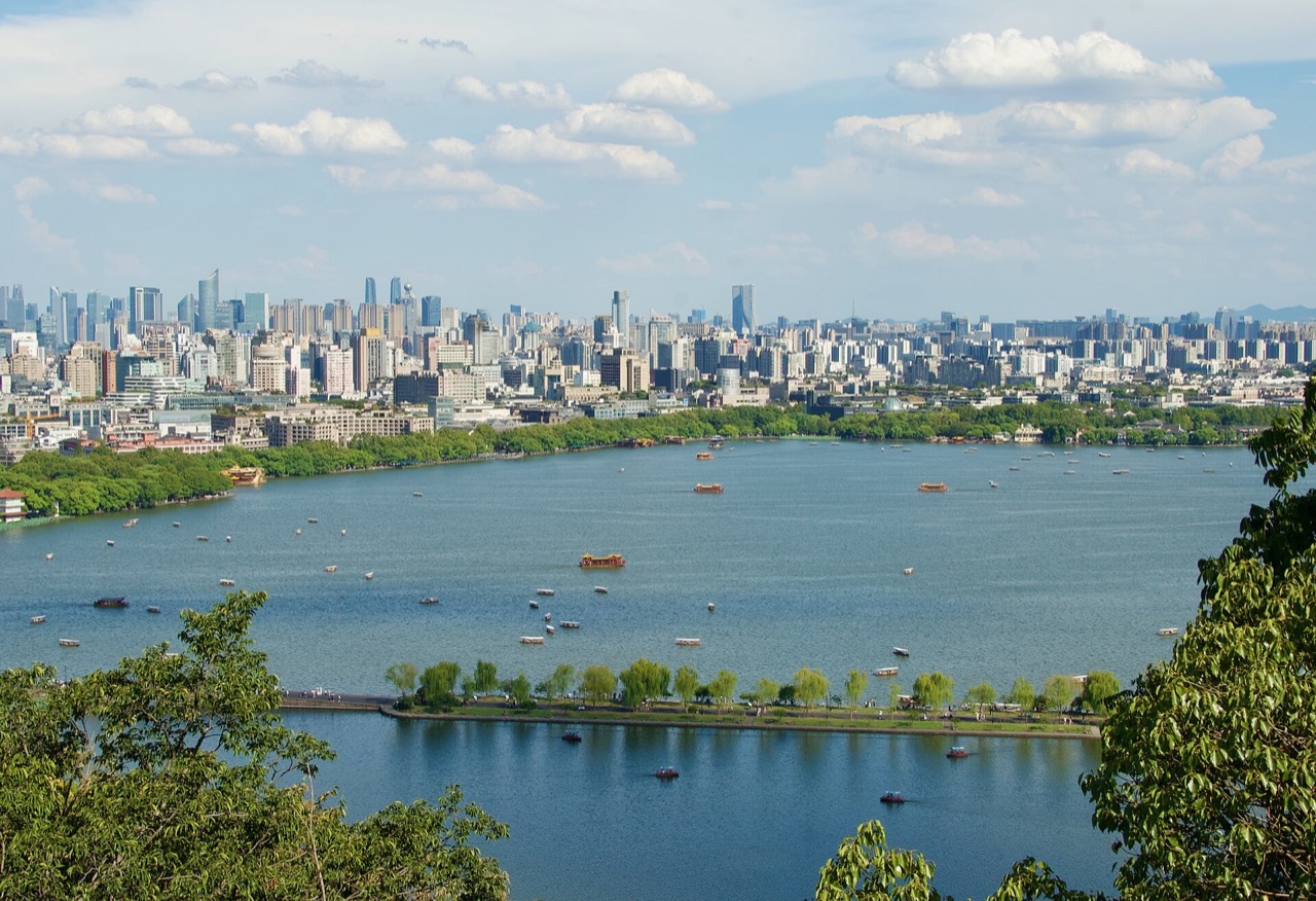 West Lake, Hangzhou — causeway and lake at first light