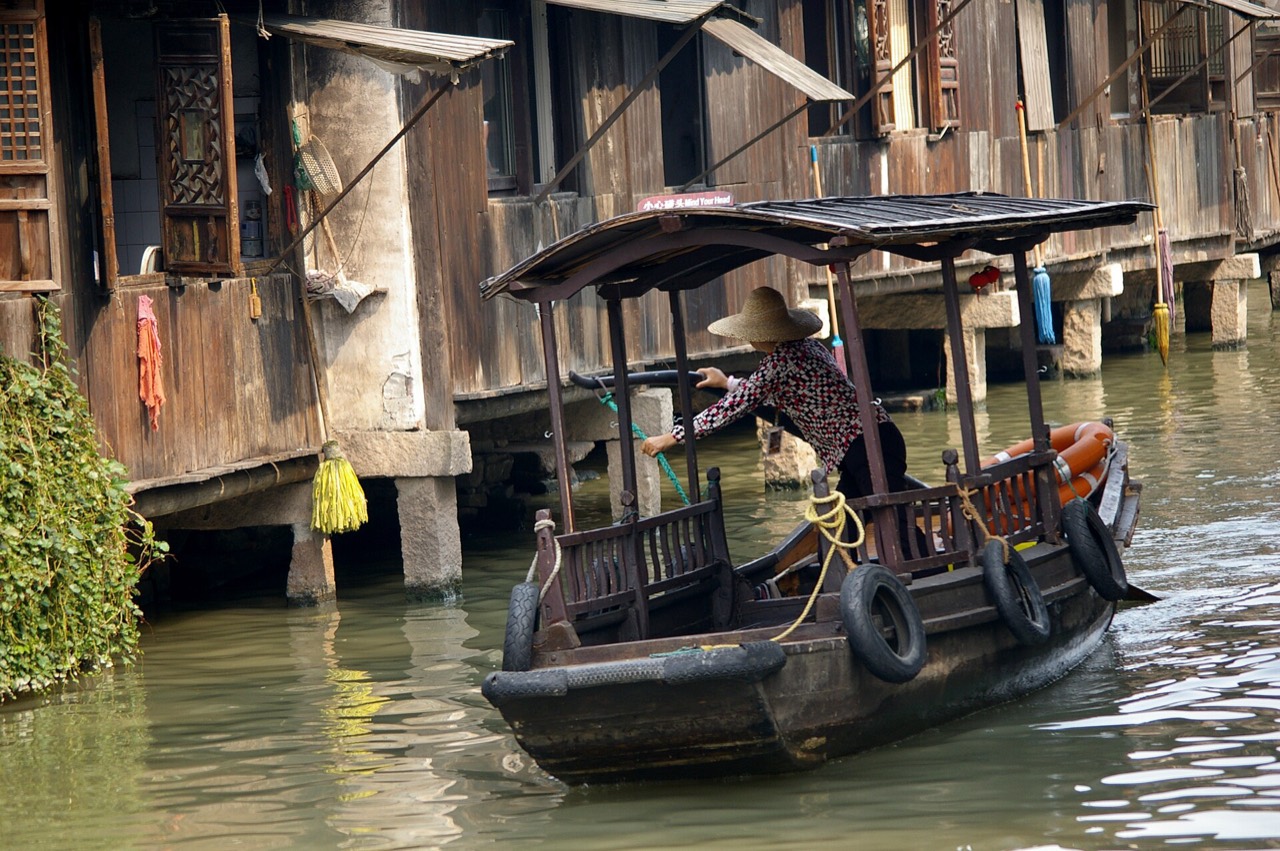 Wuzhen water town canal with stone bridges and old houses