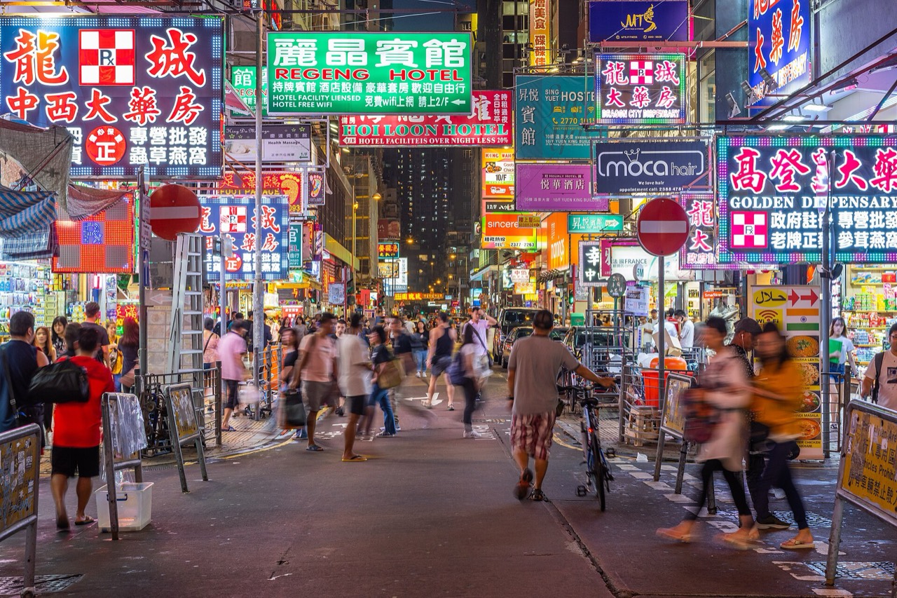 Neon signs over a Mong Kok street at night, Kowloon