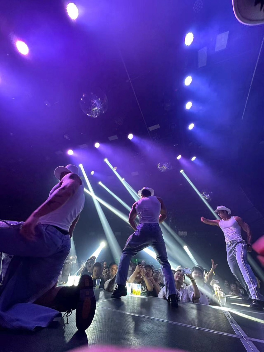 Go-go dancers on the thrust stage at Sister Club, Guangzhou