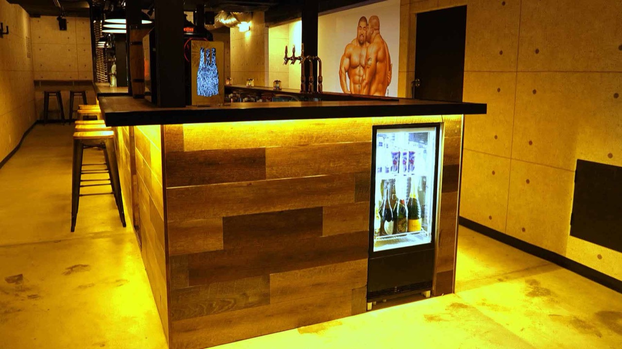 Inside Eagle Tokyo — the bar room with its Tom of Finland-style mural