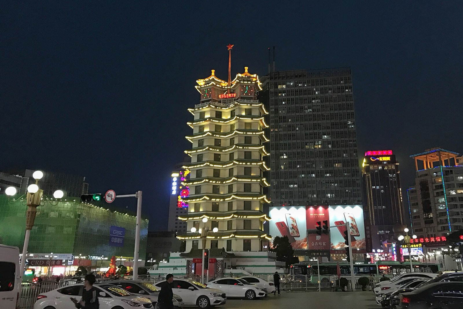 Zhengzhou at night — the Erqi Memorial Tower and downtown lights